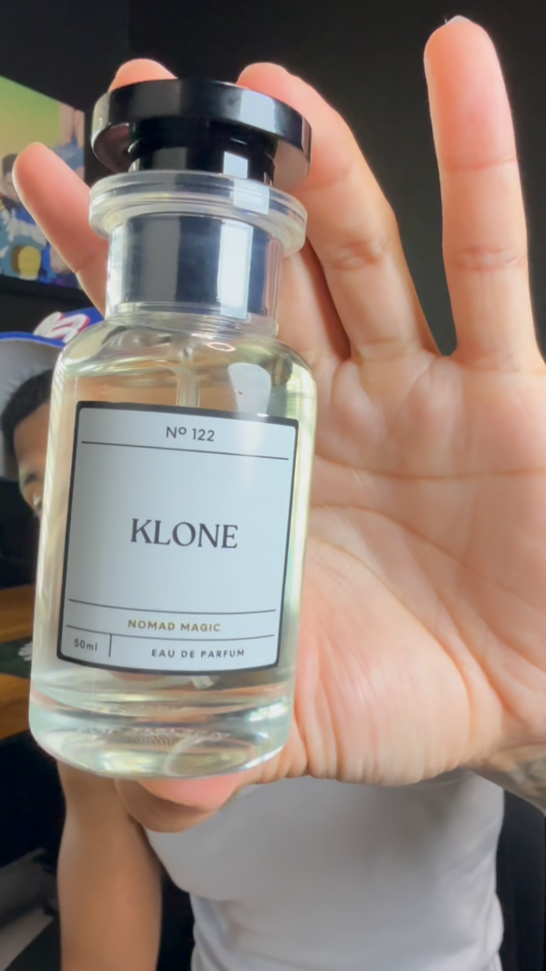Holding Klone Scents bottles